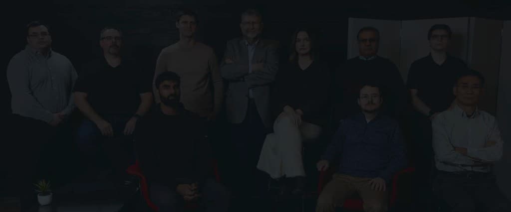 Vail Research team posing together in a modern office lounge