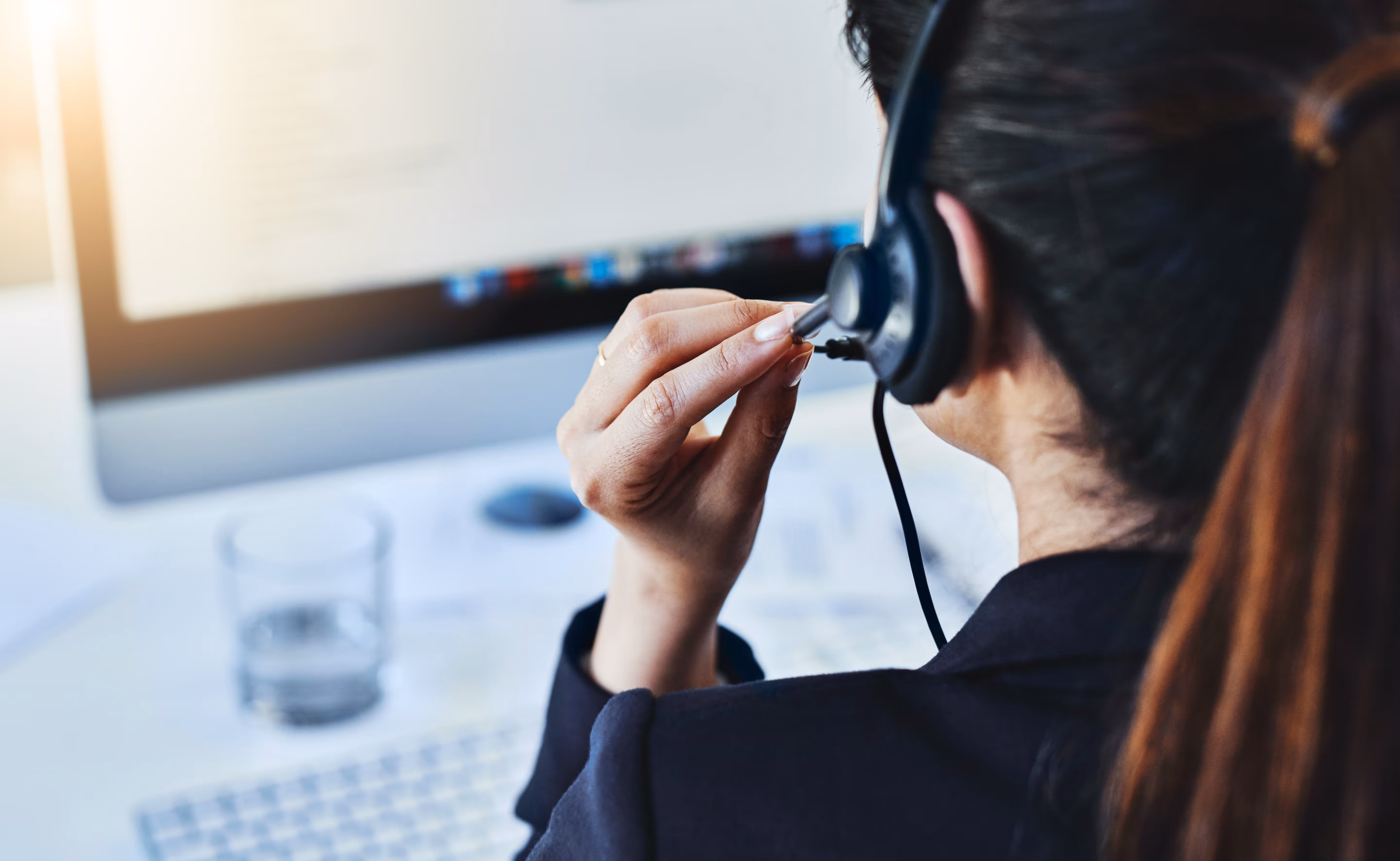 Contact center agent wearing a headset