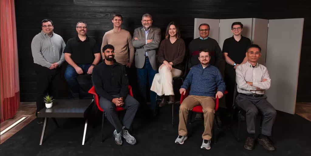 Vail Research team posing together in a modern studio setting